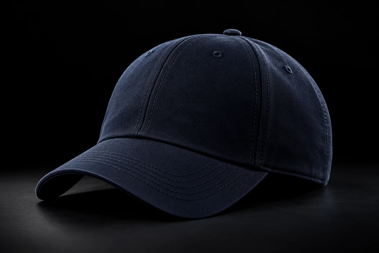 Illustrative navy twill baseball cap with detailed stitching